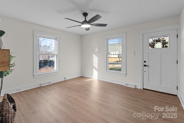 foyer featuring ceiling fan and light hardwood / wood-style floors