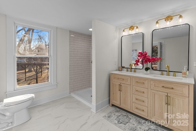 bathroom with toilet, a tile shower, and vanity