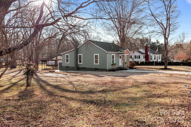 view of side of home featuring a lawn