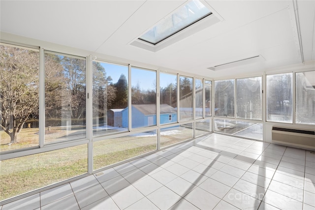 unfurnished sunroom featuring a skylight