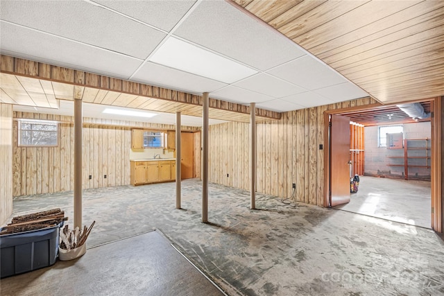 basement with sink and a drop ceiling