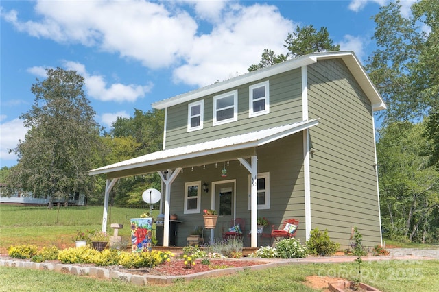 view of front facade with a porch and a front lawn