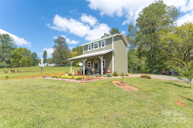 view of front of house with covered porch and a front lawn