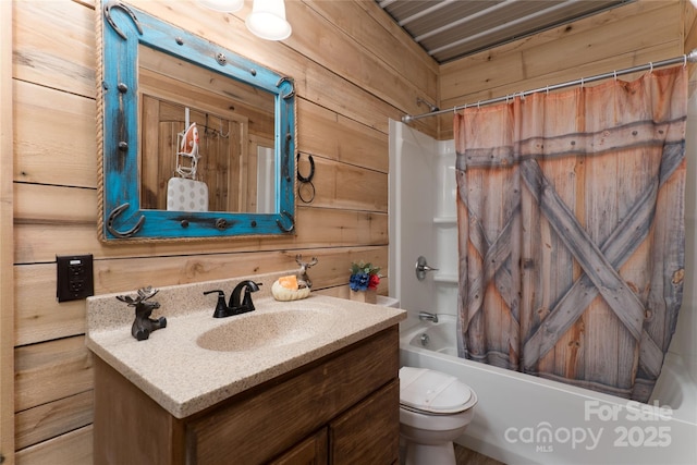 full bathroom featuring toilet, wooden walls, shower / bath combination with curtain, and vanity