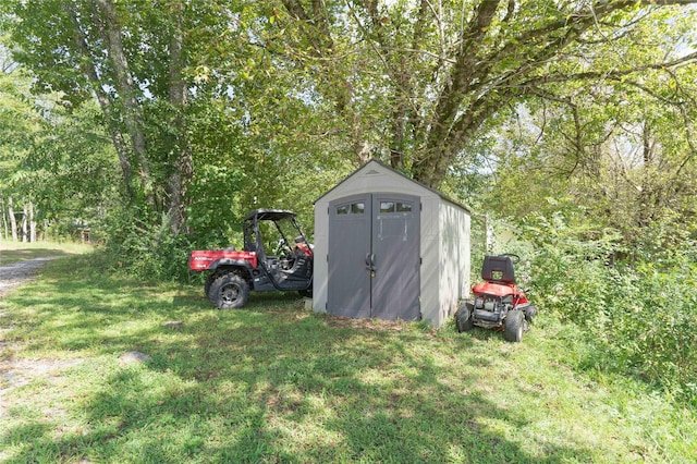 view of outdoor structure with a lawn