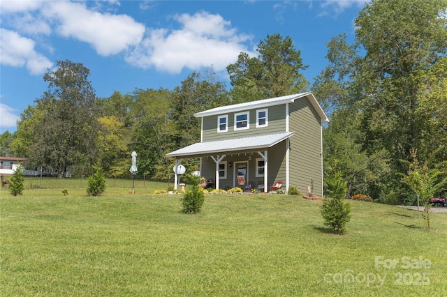 view of front of property featuring a front yard and covered porch