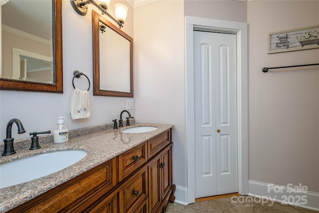 bathroom featuring ornamental molding, tile patterned floors, and vanity