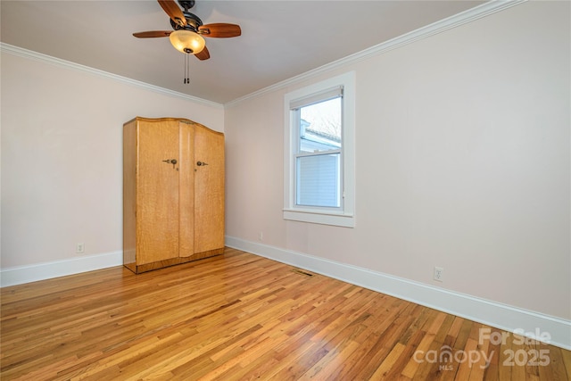 unfurnished bedroom with ceiling fan, crown molding, and light hardwood / wood-style flooring