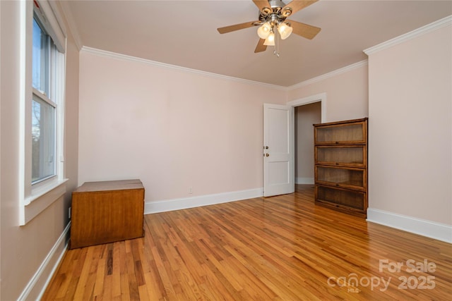 spare room with ceiling fan, light hardwood / wood-style flooring, and crown molding