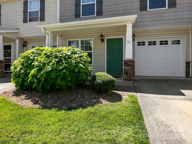 doorway to property featuring a garage