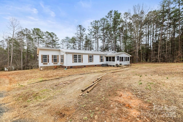 view of front of home featuring a sunroom