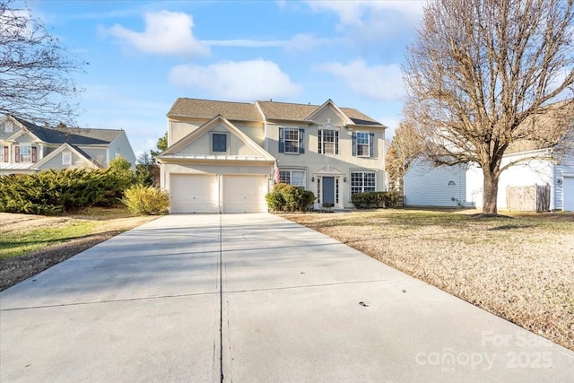 view of front of home featuring a front yard and a garage