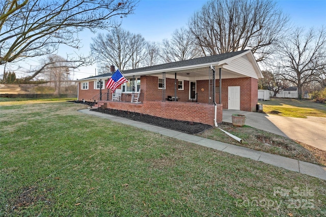 ranch-style house with a porch and a front yard