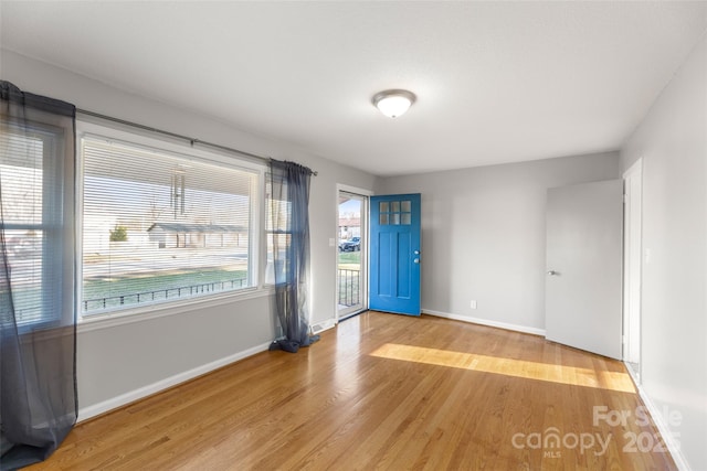 spare room with light hardwood / wood-style floors