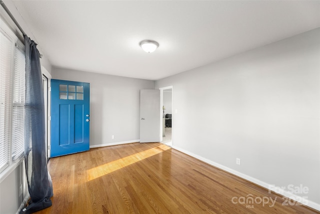 spare room with hardwood / wood-style floors