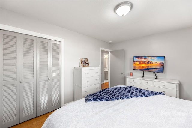 bedroom with a closet and light hardwood / wood-style floors