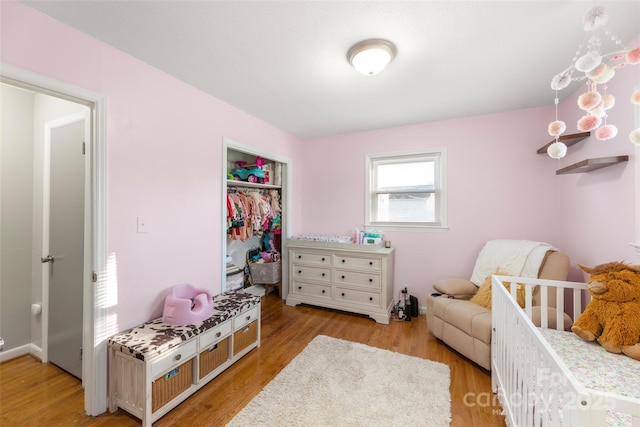 bedroom featuring a closet and light hardwood / wood-style flooring