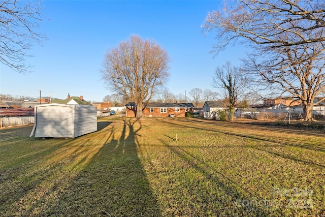 view of yard featuring a storage unit