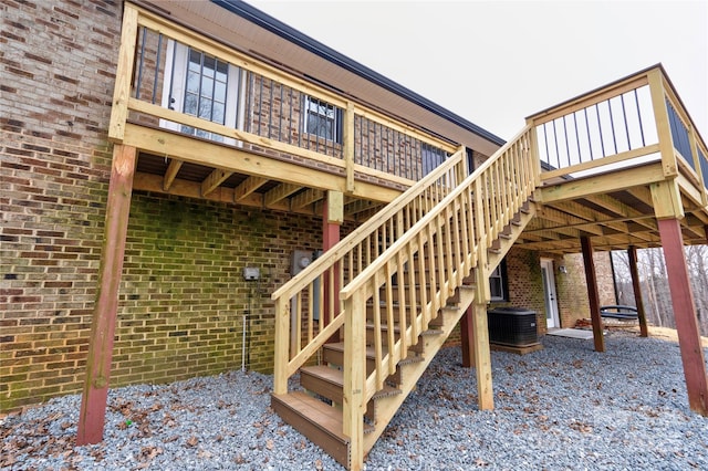 exterior space featuring cooling unit and a wooden deck