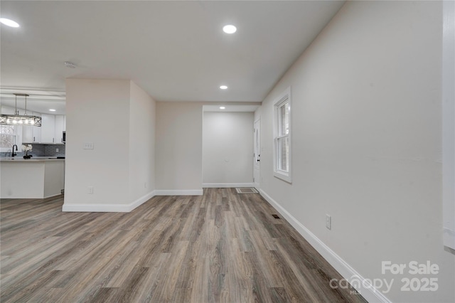 empty room with light hardwood / wood-style floors