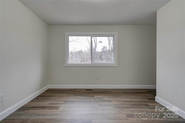 empty room featuring dark hardwood / wood-style floors