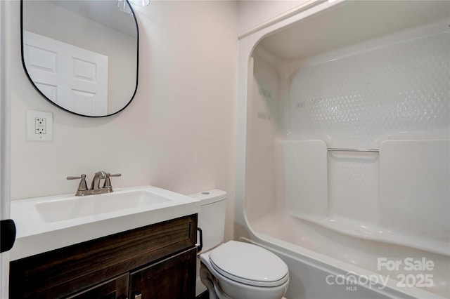 full bathroom featuring toilet, washtub / shower combination, and vanity