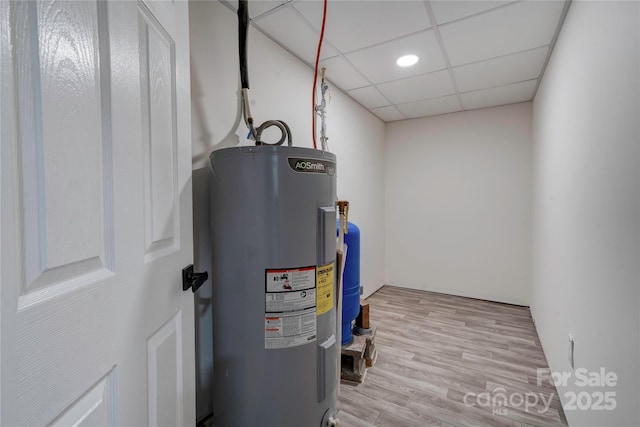 utility room with water heater