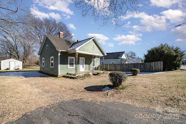 view of side of property with covered porch