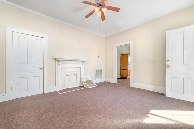 unfurnished living room with ceiling fan, crown molding, and carpet flooring