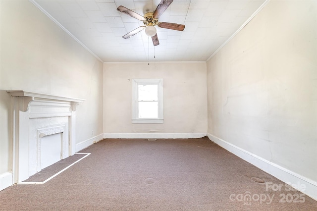 unfurnished living room featuring carpet floors, ceiling fan, and ornamental molding