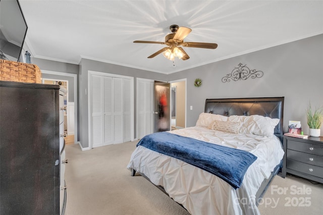 bedroom with light colored carpet, two closets, ceiling fan, and ornamental molding