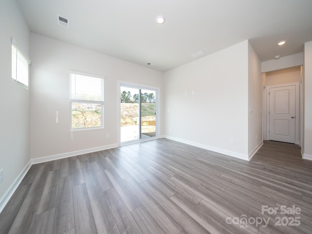 spare room featuring hardwood / wood-style flooring