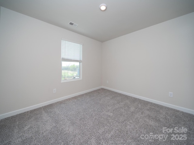 empty room with carpet flooring