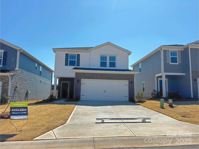 1212 31st St NE, Conover, NC 28613 - view of front of house with a garage, brick siding, and driveway