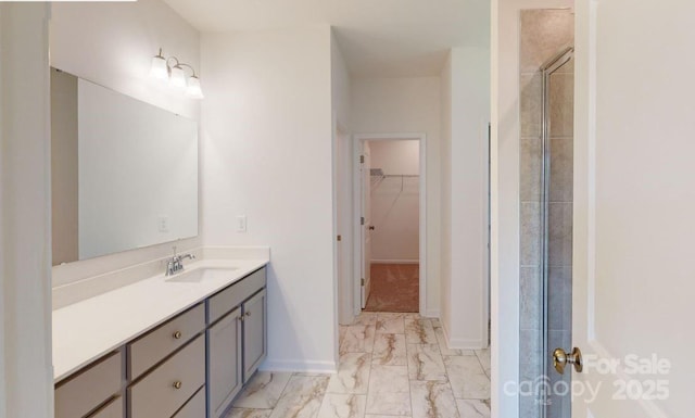 bathroom featuring vanity and a shower with shower door