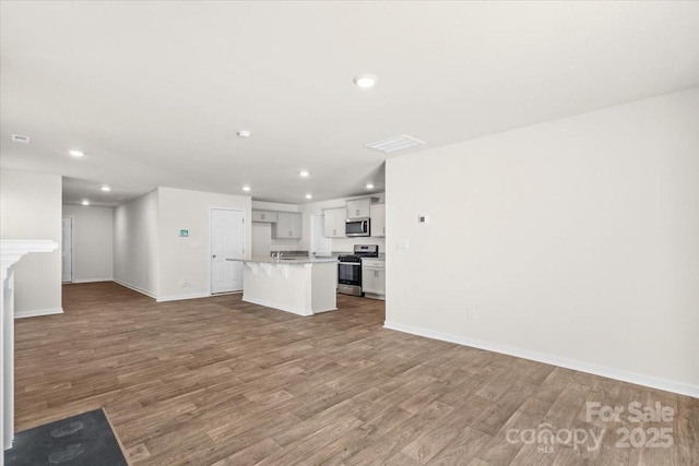 unfurnished living room with light wood-type flooring