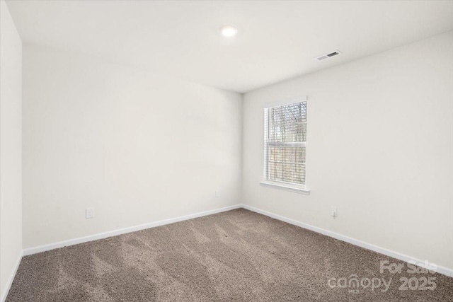 unfurnished room featuring carpet flooring