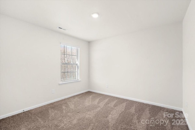 view of carpeted spare room