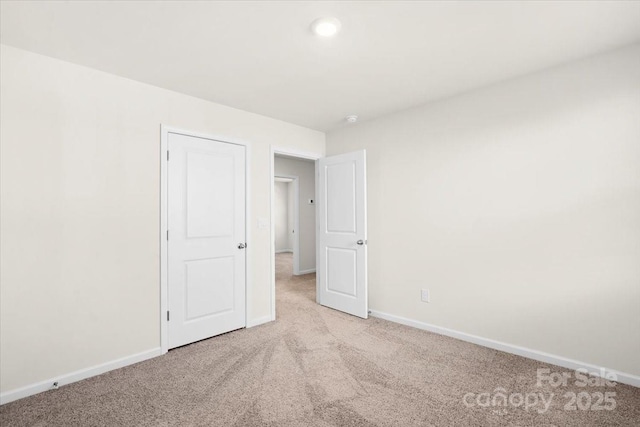 unfurnished bedroom with light carpet