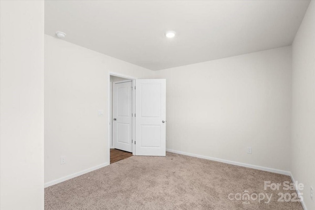 empty room with carpet flooring