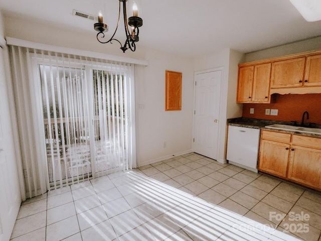 kitchen featuring sink, an inviting chandelier, light tile patterned flooring, white dishwasher, and pendant lighting