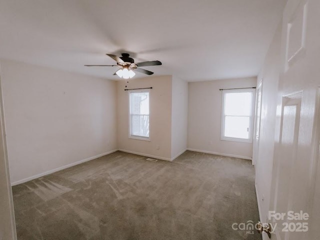 carpeted empty room with ceiling fan