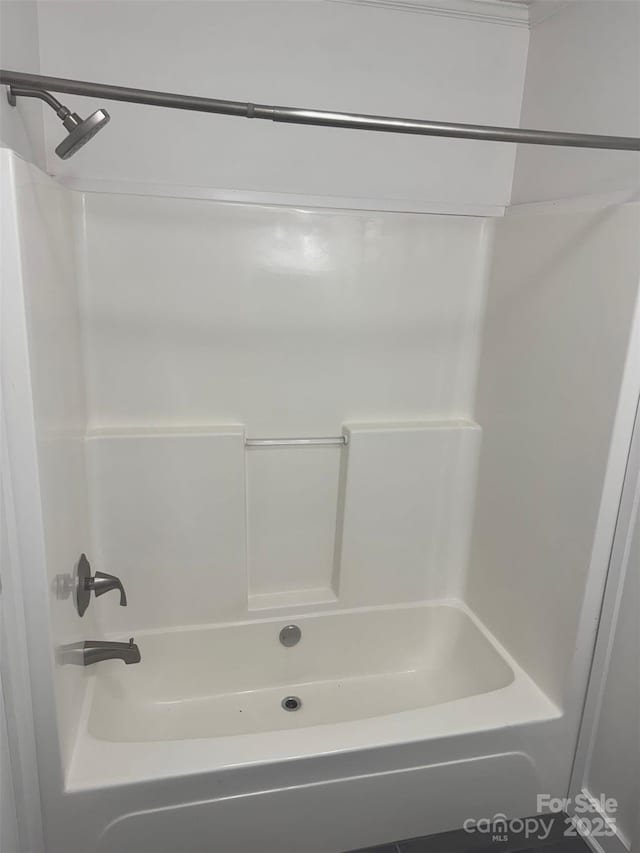 bathroom with bathing tub / shower combination