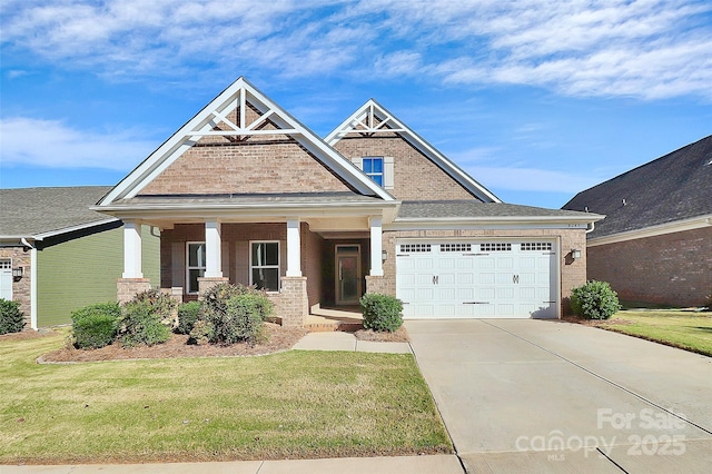 craftsman-style home with a front yard, a porch, and a garage