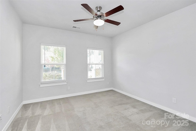 carpeted empty room with ceiling fan