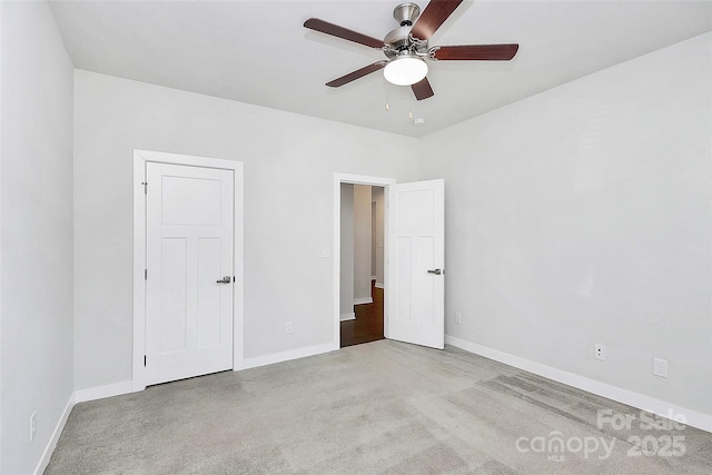 unfurnished bedroom featuring ceiling fan