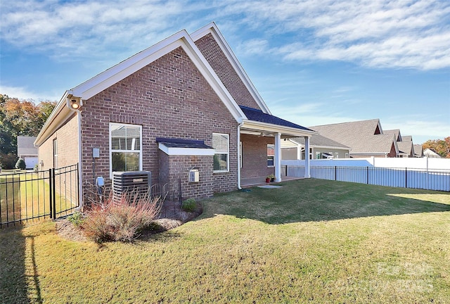 rear view of house with a yard