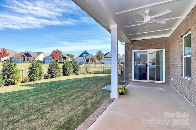 view of yard featuring a patio area and ceiling fan