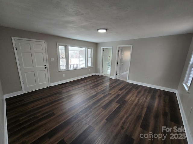 entrance foyer with dark hardwood / wood-style flooring