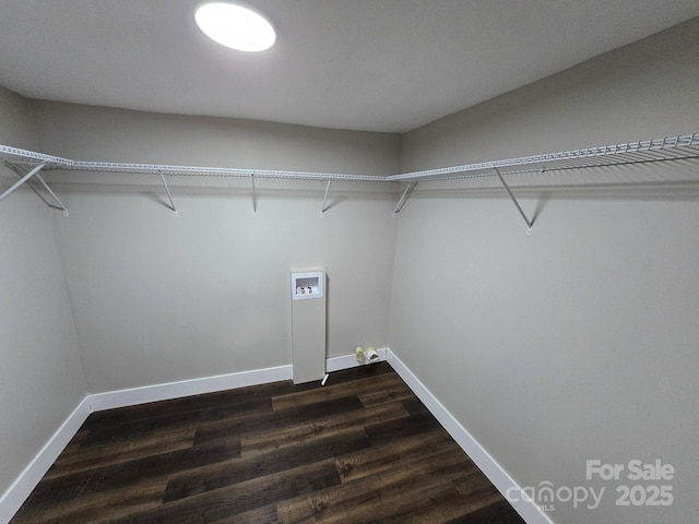 washroom featuring hookup for a washing machine and dark hardwood / wood-style flooring